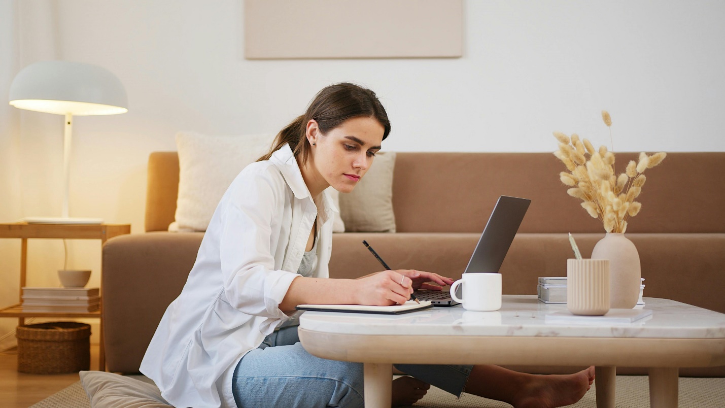 Woman Writing on a Notebook 